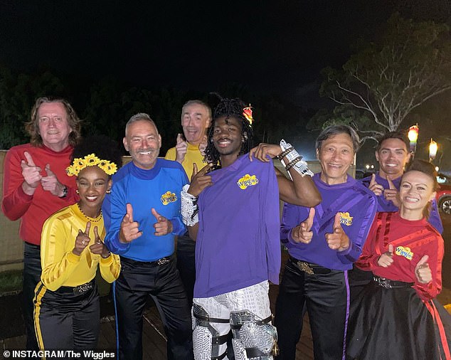 The Wiggles (pictured) are in hot water with some of their fans after posing with rapper Lil Nas X (center, holding a purple Wiggles t-shirt).  The image, taken at the Falls Festival in Melbourne during Lil Nas X's Australian tour, was captioned: 