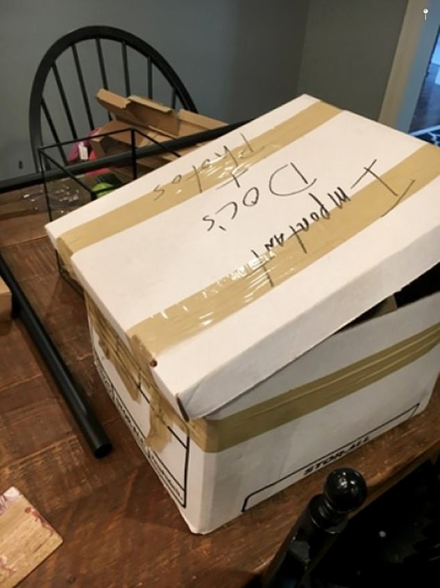 A box labeled 'Important Doc's + Photos' appears to have been left unsealed on a table at President Joe Biden's Delaware home.