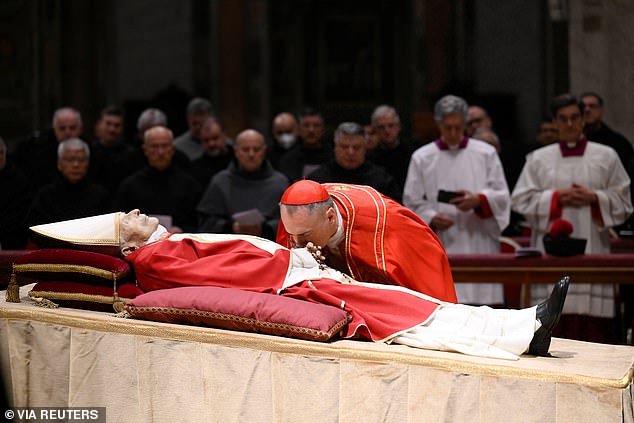 The body of Pope Benedict on public display in St. Peter's Basilica in the Vatican, where the public pay their respects.