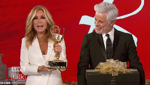 The Latest: The Young and the Restless actress Tracey E. Bregman received an Emmy trophy from her co-star Christian LeBlanc, 64, on Tuesday's edition of The Talk, to replace the one she lost in the fire Woolsey's over four years ago.