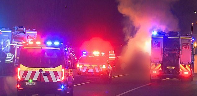 Police officers and passing motorists tried to extricate the trapped occupants from the burning wreckage, but were unable to reach them because of the flames and heat.