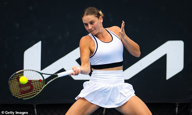 Marta Kostyuk of Ukraine in action against Amanda Anisimova of the United States in their first round match at the Australian Open