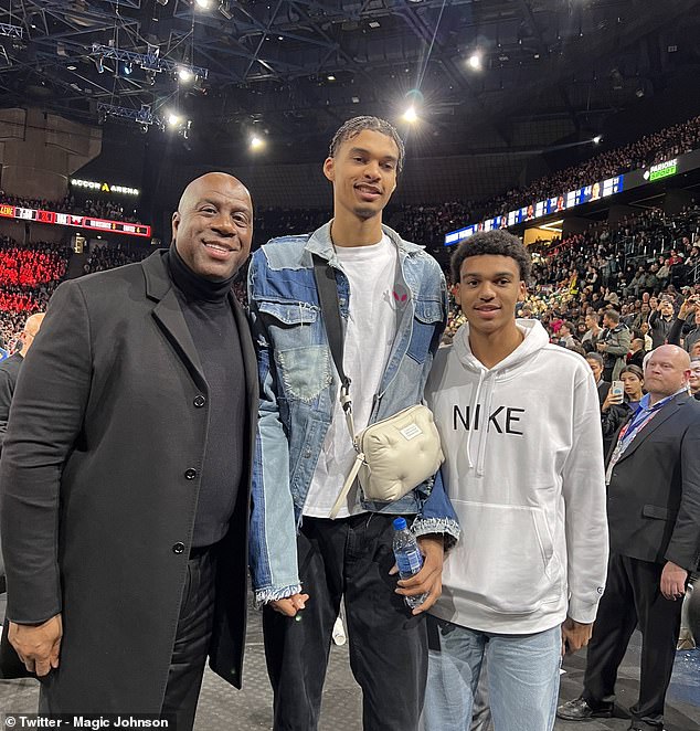 Lakers icon Magic Johnson (left) called Victor Wembanyama (center) the best in the world