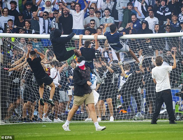 Melbourne Victory 'fans' invade the pitch during the A-League derby on December 17 at AAMI Park