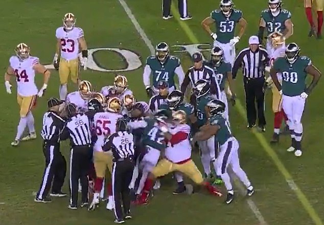 49ers offensive lineman Trent Williams is seen throwing K'Von Wallace (42) to the ground