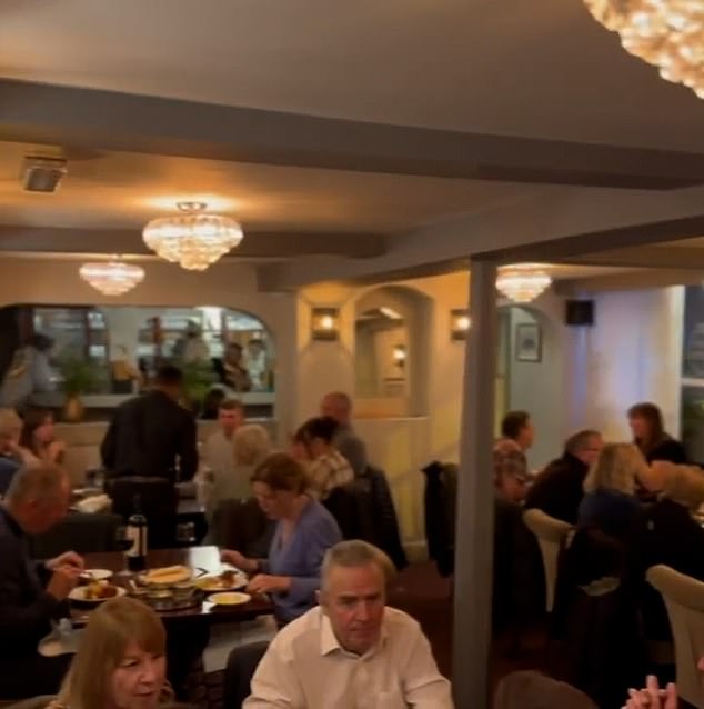 An Indian restaurant is at the center of a scandal after a woman claimed she saw her husband, who died nine years ago, dining at the Indian restaurant.  Spice Cottage in Westbourne, near Chichester in West Sussex, was inundated with comments about their latest promotional video (above), which they said was shot a few weeks ago.