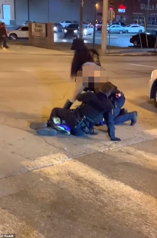 A viral video shows a woman trying to distract two security guards as they tried to control a man who was fighting them after a Kansas City Chiefs game.