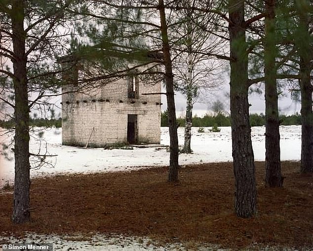 Simon Menner traveled to Lithuania last year, where he captured this image of a sniper hiding in plain sight.  So, can YOU find the shooter inside the snowy scene?