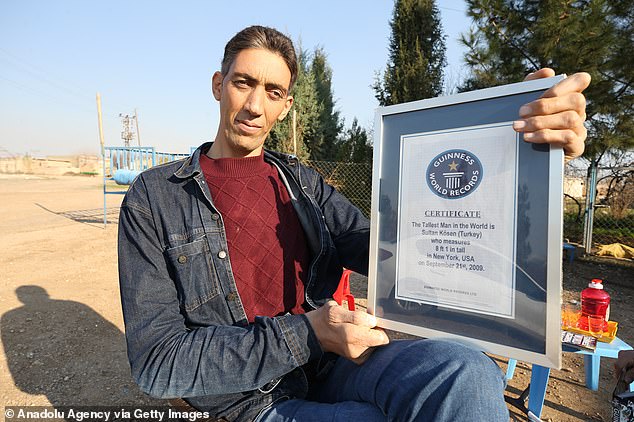 Sultan Kösen, 40, who stands at 8ft 3in, proudly flaunted his certificate during an interview with Anadolu Agency in the Dede village of Mardin, Turkey on January 3, 2023.