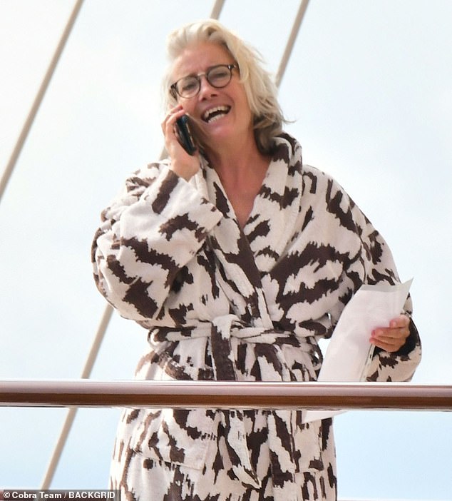 Dame Emma, ​​64, was spotted making an animated phone call on the deck of the yacht, wearing a £225 animal print coat by Alexa Chung