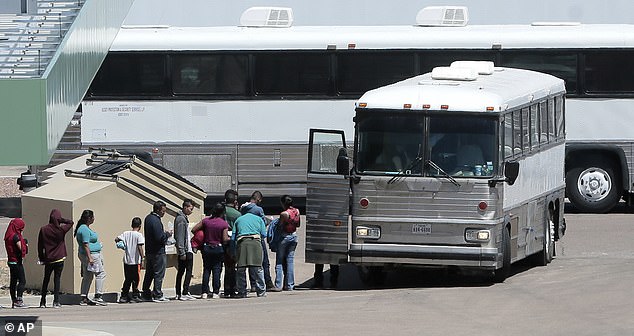 The photo shows migrants leaving El Paso, Texas on a bus near Border Patrol headquarters