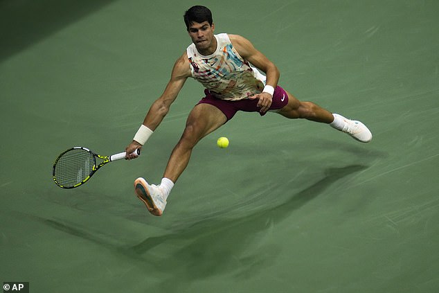 The defending champion stretches to reach a forehand at Arthur Ashe Stadium