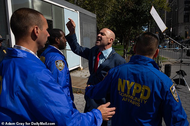 His speech at the Foley Square event on Thursday was met with opposition from three anti-migrant protesters who called on President Joe Biden to 