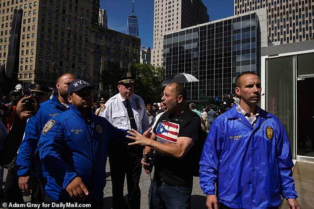 But his words were met with boos and jeers from three protesters present before they were led away