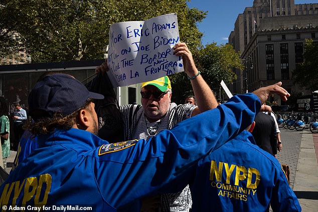 One man held up a sign that read, “Mayor of New York, Eric Adams.  We must call on Joe Biden to close the border now!”  He also added the Spanish translation for 'close the border now'