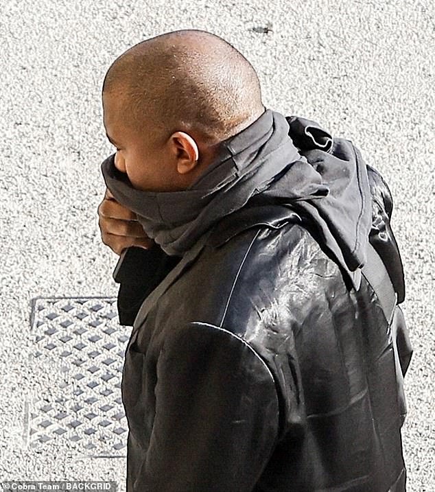 Bundled up: The hip-hop star bundled up in an all-black look and kept his face shielded for the outing