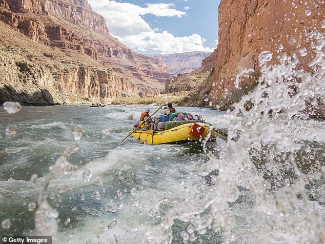 Whitewater rafting through rapids on the Colorado River is a popular activity among tourists