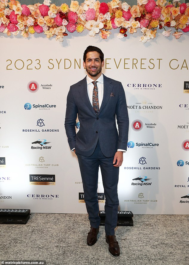 The fan-favorite groom flaunted his handsome figure and donned a tailored black suit with a muted paisley tie