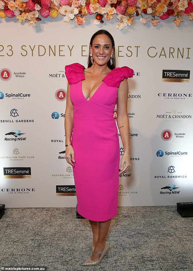 Professional boxer Renee Gartner, 39, puts on a busty show in a hot pink dress with a plunging neckline