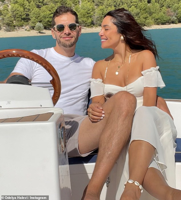 Festive: The couple stepped into another summer ensemble as they took their engagement party to the water for a ride on a boat