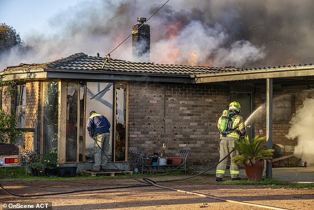 Neighbors helped try to contain the fire to the garage, where the fire is believed to have started from a faulty electrical appliance (pictured, house)