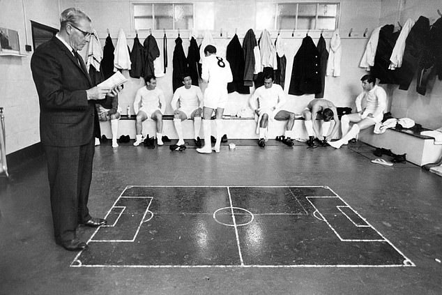 George Martin stands by the tactics board on the locker room floor prior to a duel with Halifax