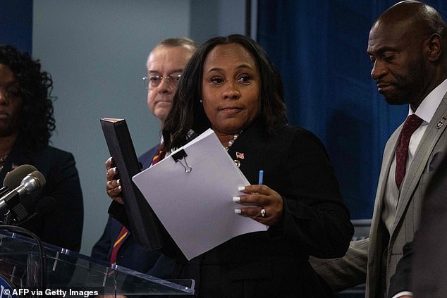 The massive racketeering case comes from Atlanta District Attorney Fani Willis, who claims to have collected a body of evidence proving the then president conspired to overturn local election results.  She is seen here at a press conference at the Fulton County Government Center after a grand jury voted Aug. 14 to indict Trump