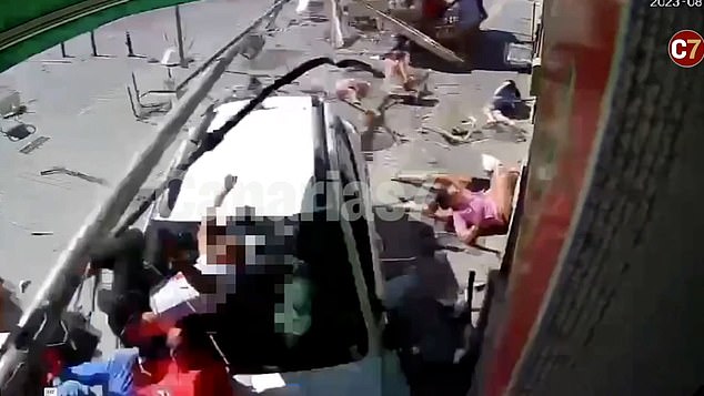 This is the horror moment when a British tourist drives into a crowded café terrace on the holiday island of Fuerteventura in a rental car