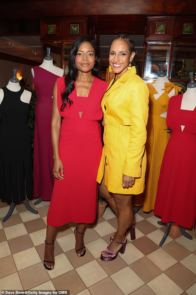 Glam: Also at the event was British writer Afua Hirsch, 42, who wore a bright yellow blazer dress as she posed for a photo with Naomie