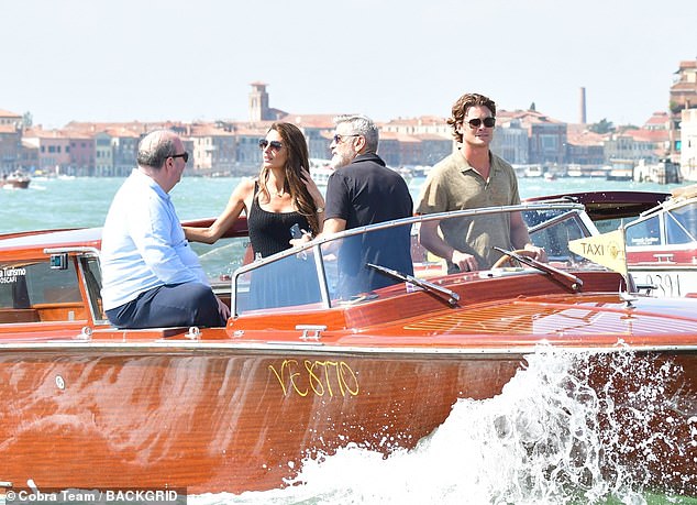 Taking Venice by storm: The group looked ready for another day in Venice after arriving earlier this week