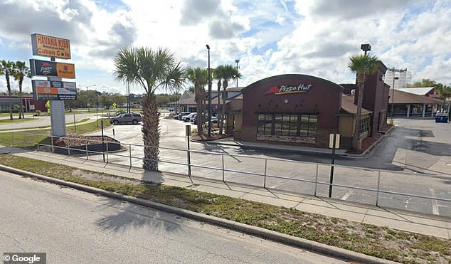 The alleged attack took place in the women's room of a Pizza Hut branch in Kissimmee, Florida.