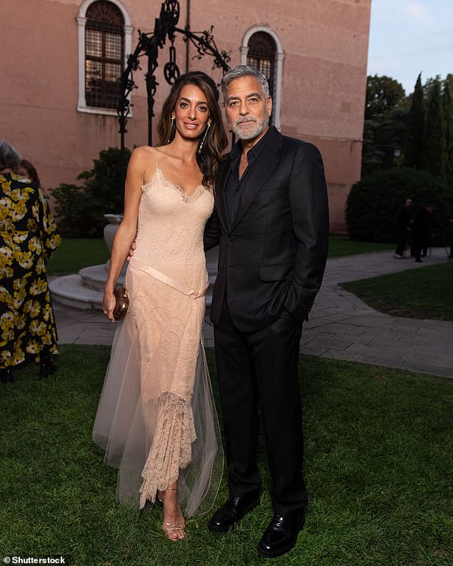 Pretty in pink: Human rights lawyer Amal, 45, looked stunning at the ceremony before being honored with the DVF Leadership Award along with four other women