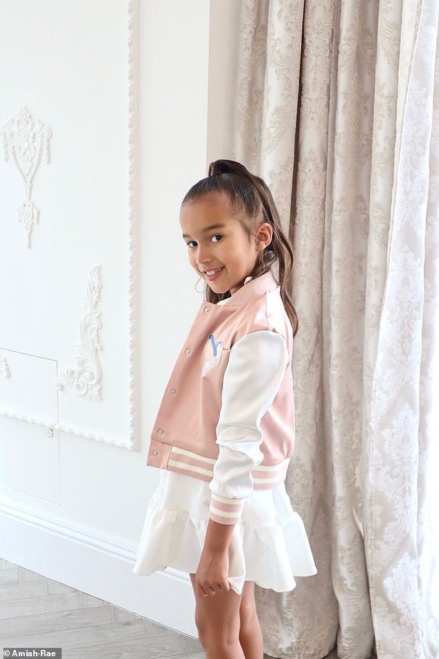 Adorable: In a series of photos, Matilda makes her modeling debut as she shows off the fashion range — from a purple sequin hoodie to a white satin dress