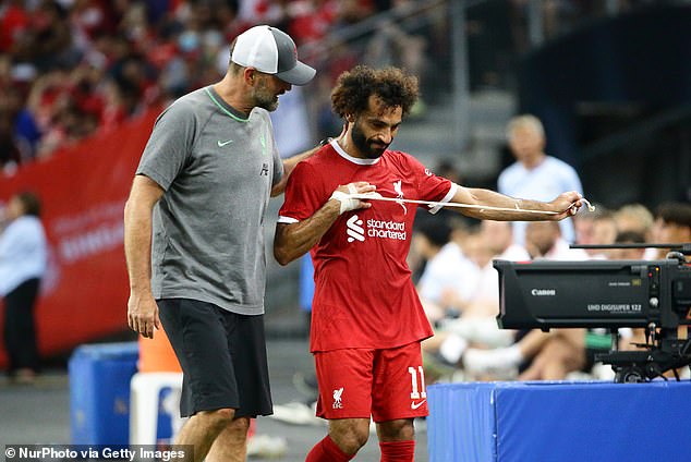 Reds boss Jurgen Klopp (left) is desperate to hold on to the Egyptian goalscorer (right)