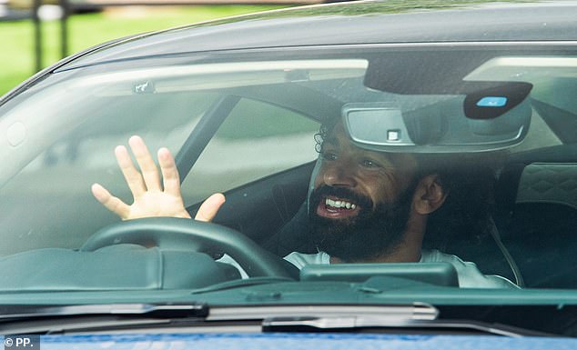 Salah waved to bystanders as he left the Liverpool training ground on Friday morning