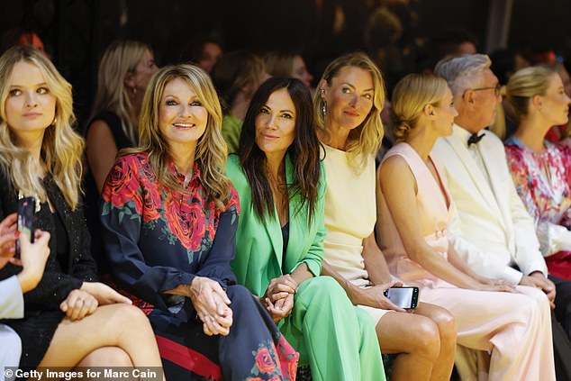 The Spencer sisters appeared in high spirits when they attended the fashion show in Germany