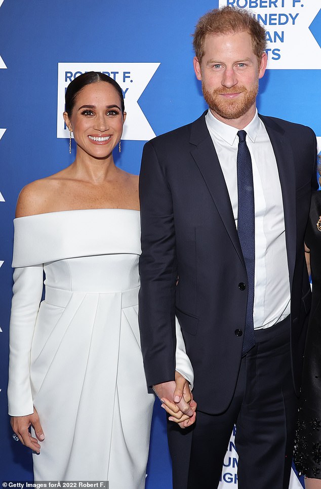 Prince Harry and Meghan Markle pictured in December 2022 - a month before the Duke of Sussex's memoirs were published