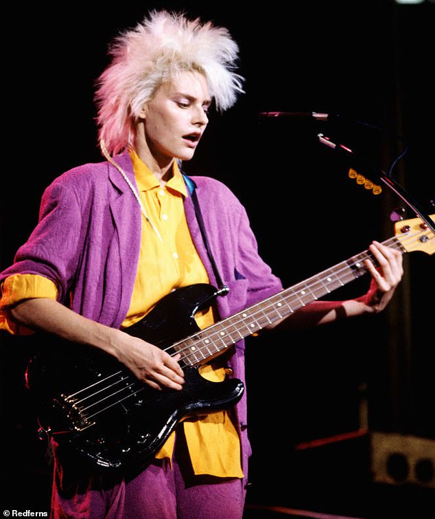 Aimee Mann is the lead singer of the American rock band 'Til Tuesday.  In the photo, she has a spiky haircut.  Manis said her inspiration for her mullet came from the 'Voices Carry' video