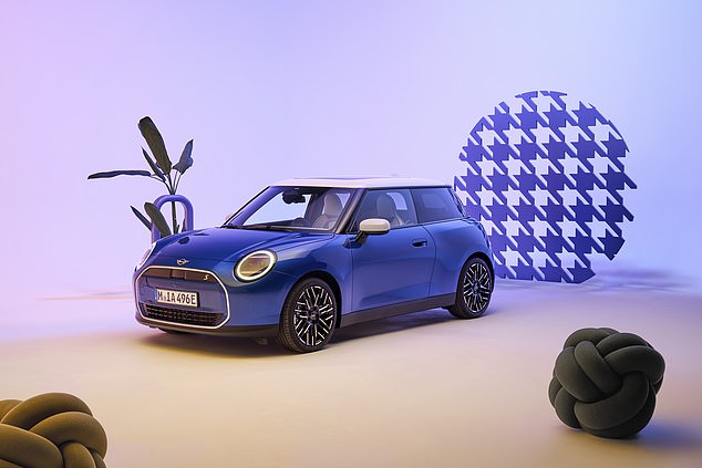 The new all-electric Mini Cooper (pictured) and the new expanded Mini Countryman were unveiled ahead of the German International Motor Show in Munich