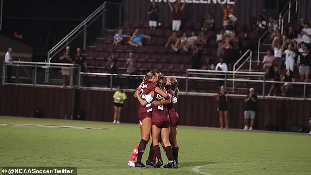 The goalkeeper is harassed by her teammates after the incredible attack for the Aggies