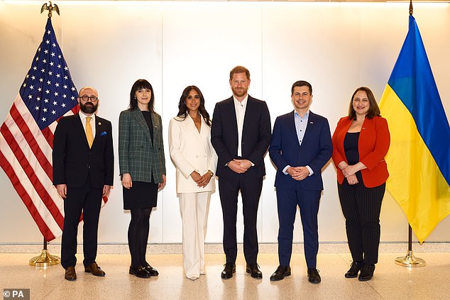 Harry and Meghan with Secretary of Transportation Pete Buttigieg (second from right) and other officials at the 2022 Invictus Games