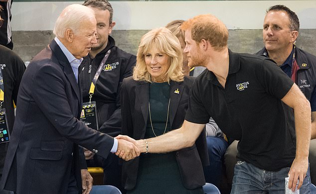 Harry shakes hands with Joe Biden, as Jill watches, at the 2017 Invictus Games in Toronto