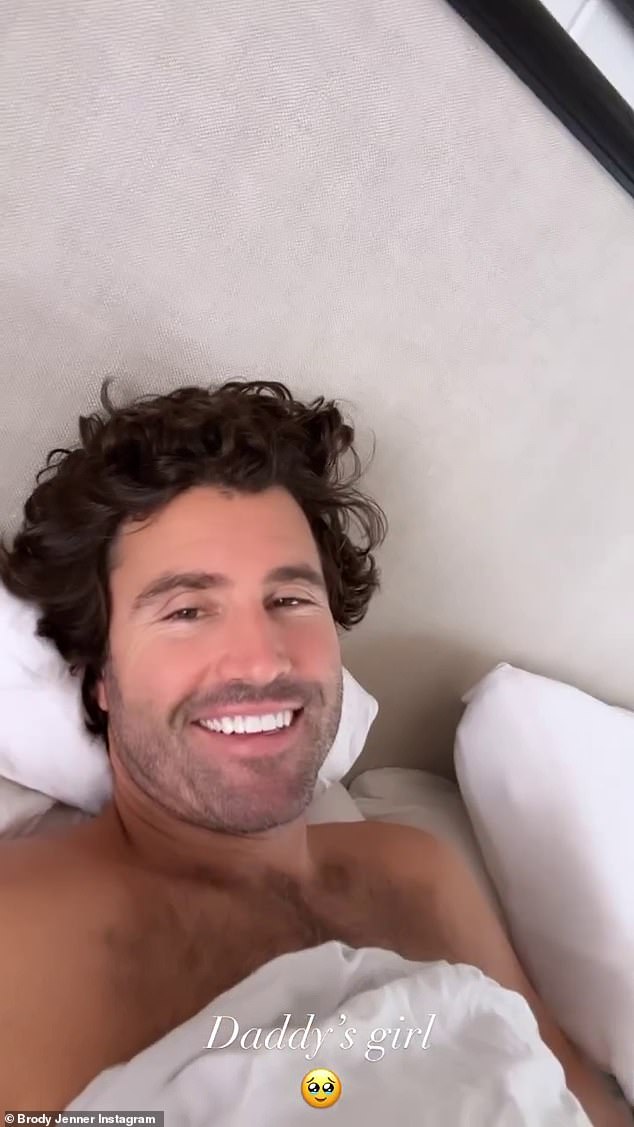 Blissful: Earlier this morning, Jenner was all smiles as Blanco filmed him in bed with Honey, in a clip called 'Daddy's girl'