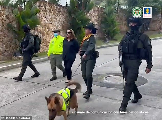 Nancy Gonzalez here in handcuffs in July 2022, after being arrested by authorities in Cali, Colombia for smuggling endangered crocodile and snakeskin bags into the US