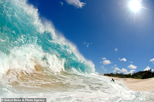 This is an eight-foot monster wave in Hawaii and a lone surfer retreats from it.  The wave that sank Owen Wright was 15 feet high