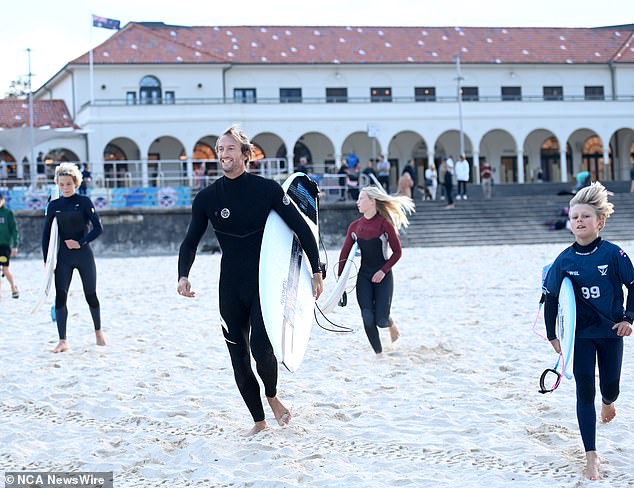 Owen Wright is today helping kids learn to surf through Surfaid