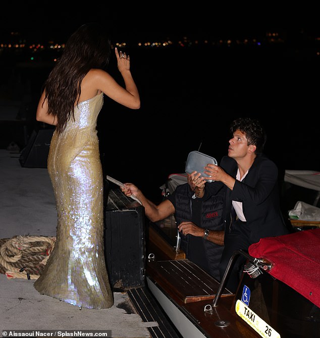 Sweet: He was holding her purse before helping her into the water taxi