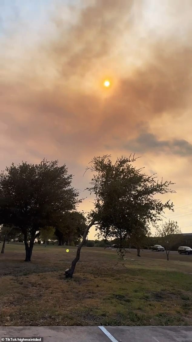 The TikTok user rotates his camera to show how much smoke has filled the air in the surrounding area