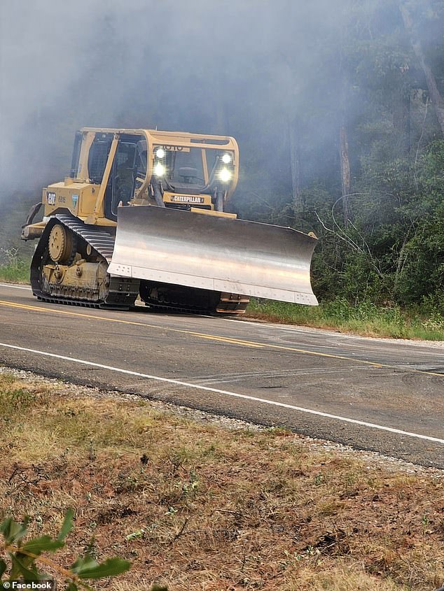 Crews on the ground have used bulldozers to create containment lines