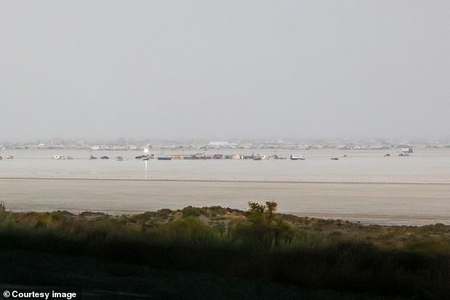 Some cars were seen stuck in the mud, with the desert looking more like a lagoon